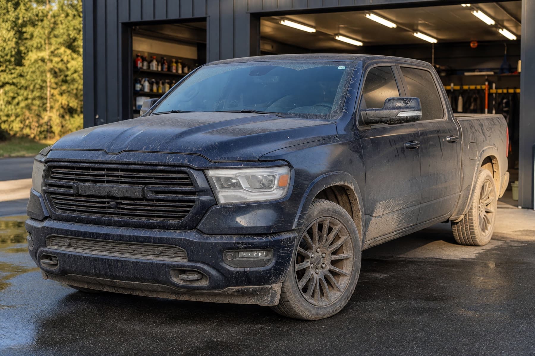 Dark blue pickup truck before a professional auto detail
