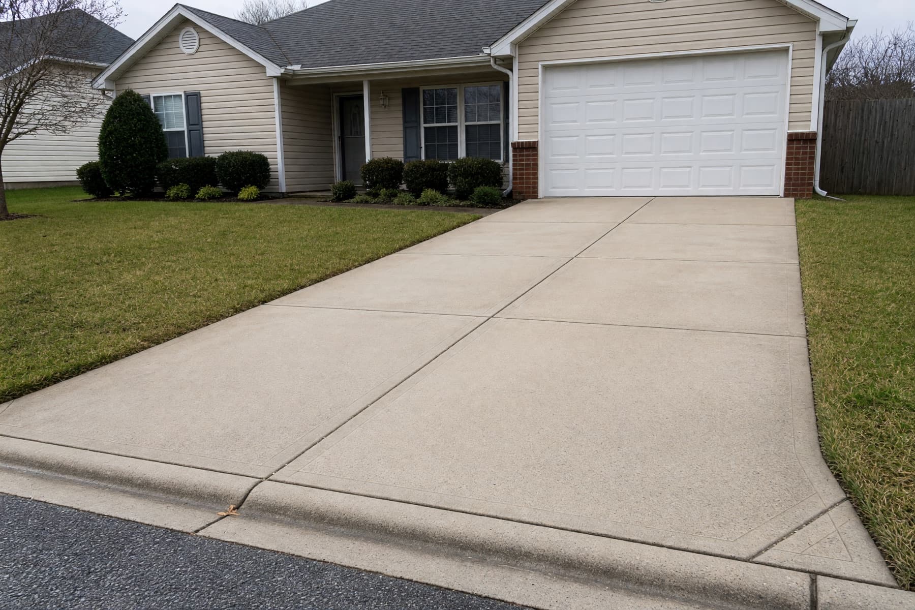 Finished residential driveway and walkway after pressure washing